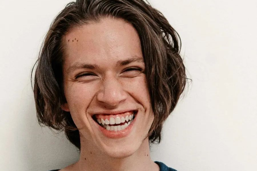 A woman smiling with joy